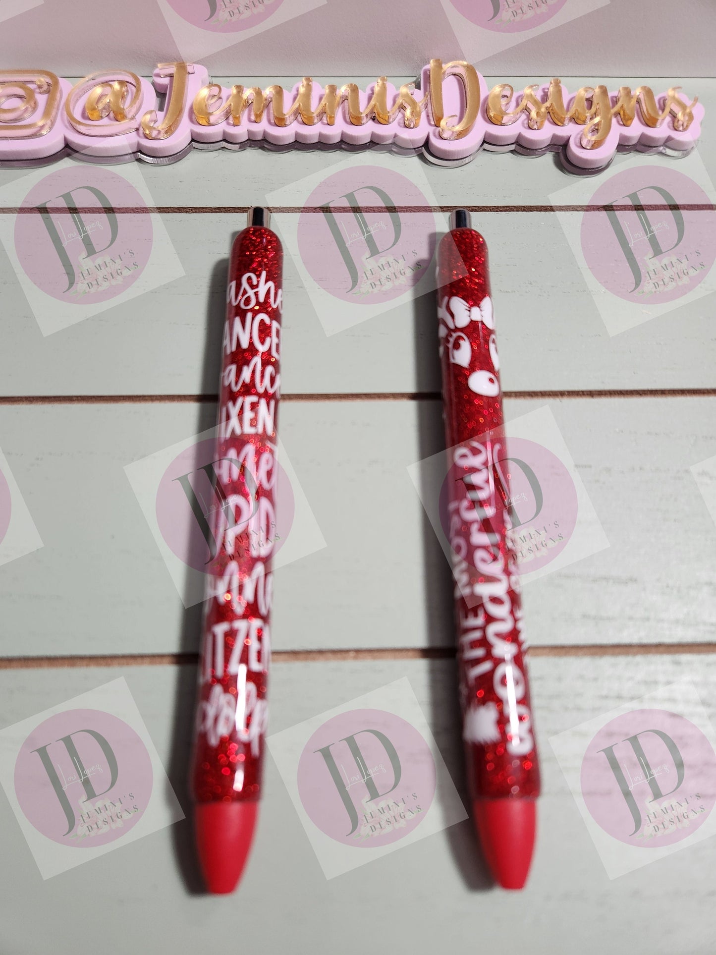 Set of 2 red glitter with white decals. Reindeer names/ clarice & Its the most wonderful time of the year Glitter Gel pens/ refillable