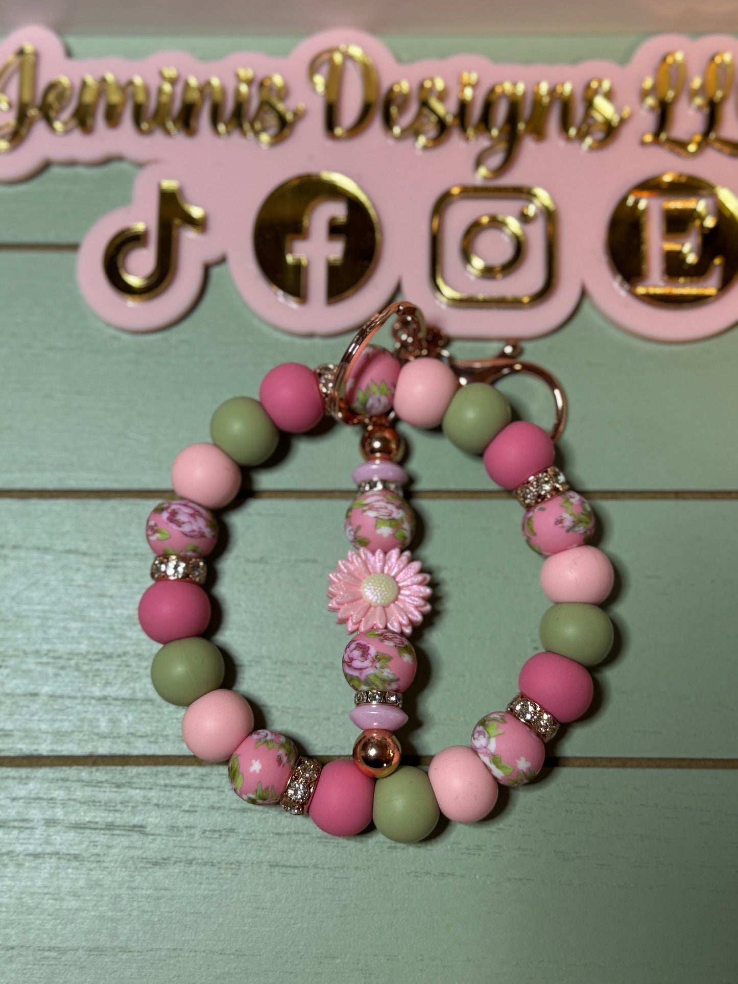 Floral pink beaded wristlets keychain, with daisy keychain bar, and bling.  Bangle wristlets floral pink keychain/rose gold colored hardware