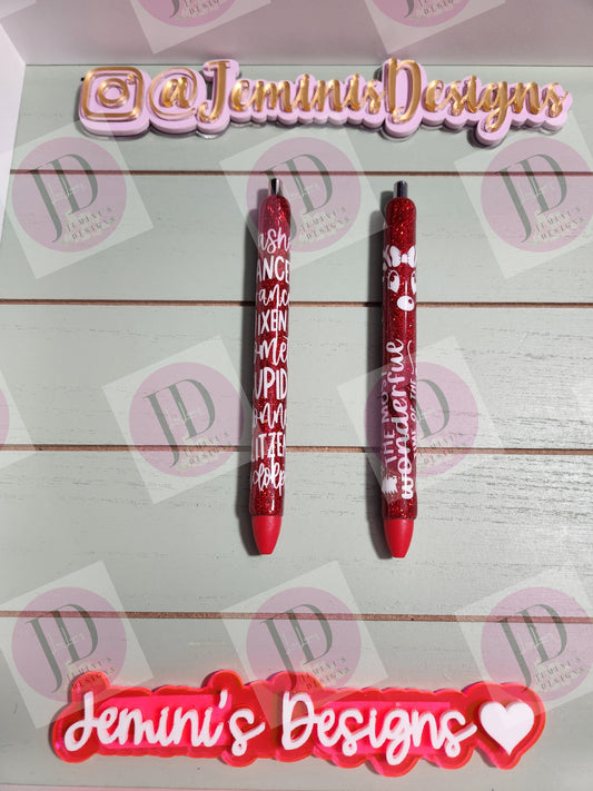 Set of 2 red glitter with white decals. Reindeer names/ clarice & Its the most wonderful time of the year Glitter Gel pens/ refillable