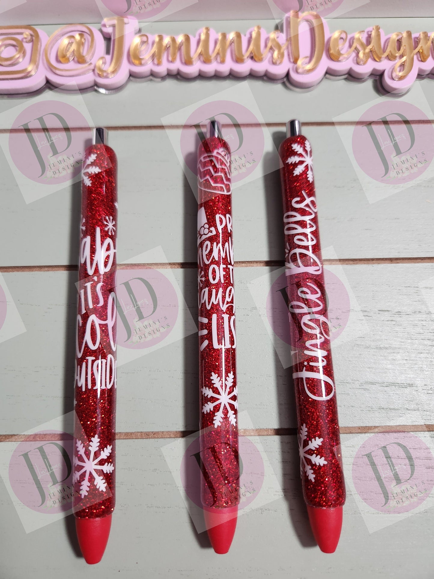 Set of 3 red glitter with white decals. Baby its cold outside/jingle bells/ proud member of the naughty list.  Glitter Gel pens/ refillable