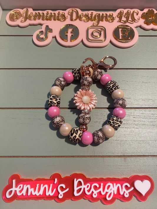 Floral pink beaded wristlets keychain, with daisy keychain bar, and bling.  Bangle wristlets floral pink keychain/rose gold colored hardware