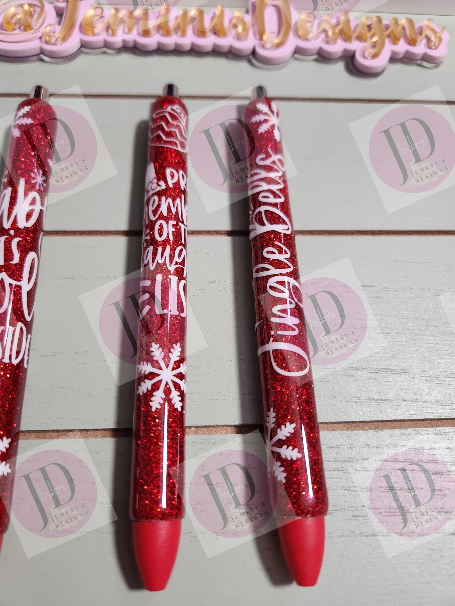 Set of 3 red glitter with white decals. Baby its cold outside/jingle bells/ proud member of the naughty list.  Glitter Gel pens/ refillable