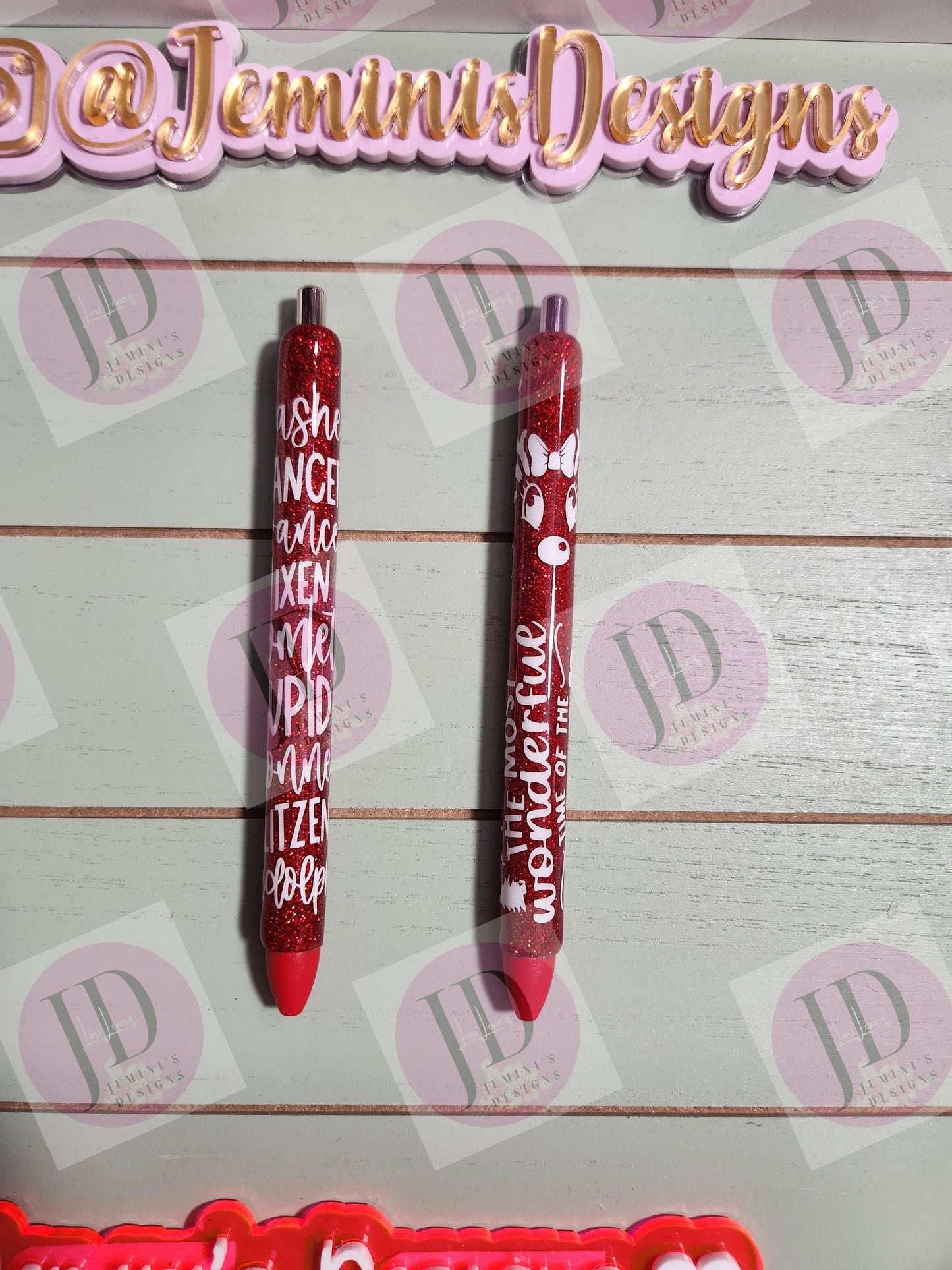 Set of 2 red glitter with white decals. Reindeer names/ clarice & Its the most wonderful time of the year Glitter Gel pens/ refillable