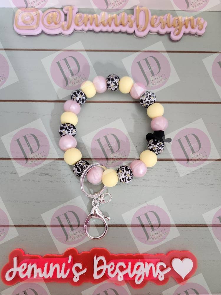 Cowboy pink pearl and soft yellow daisy cow Keychain.   Daisy bead w/ cow print. Cowboy hat bead Keychain wristlet for her