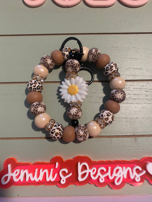 Floral tan leopard daisy beaded wristlets keychain, with daisy keychain bar, and bling.  Bangle wristlets floral earth tone keychain/rose gold colored hardware