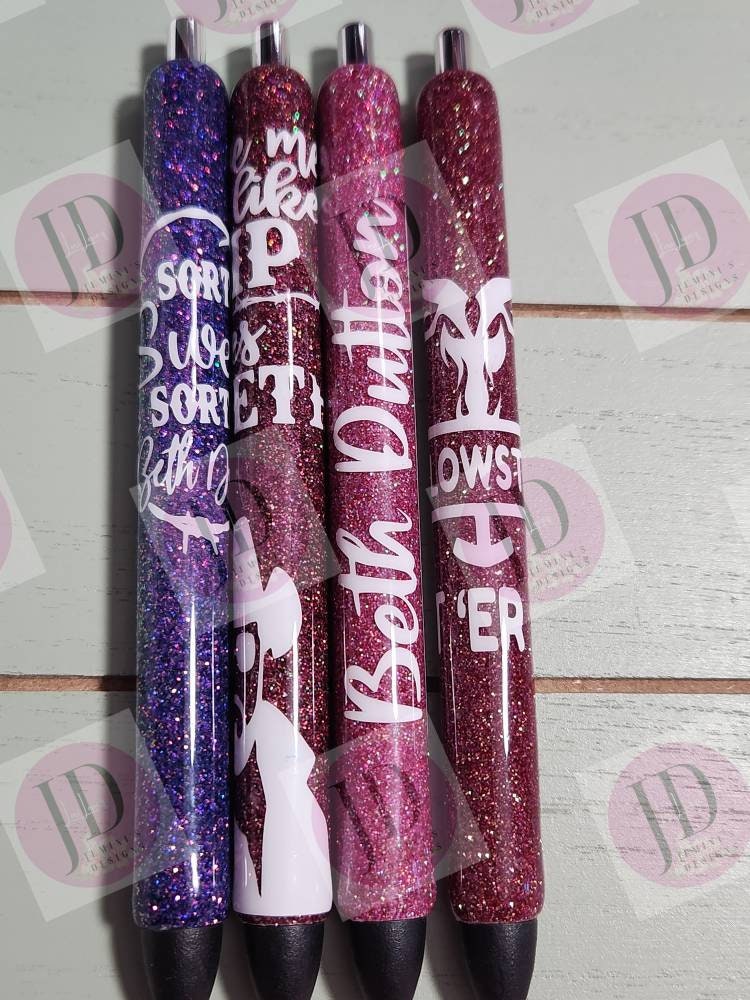 Set of 4 cowboy inspired glitter pen.  Purple and various shades of pink. Open pictures to see pen titles or video