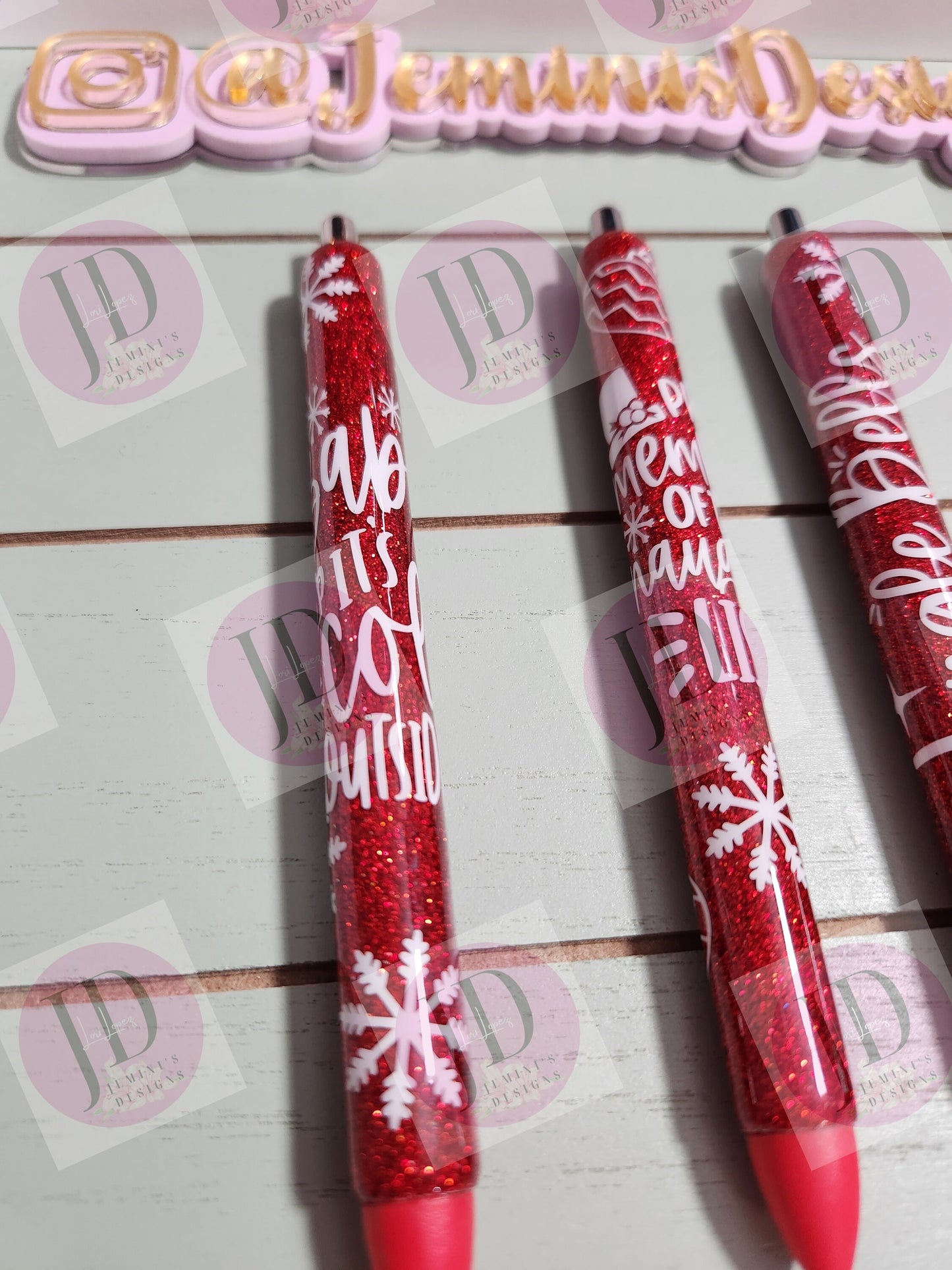 Set of 3 red glitter with white decals. Baby its cold outside/jingle bells/ proud member of the naughty list.  Glitter Gel pens/ refillable