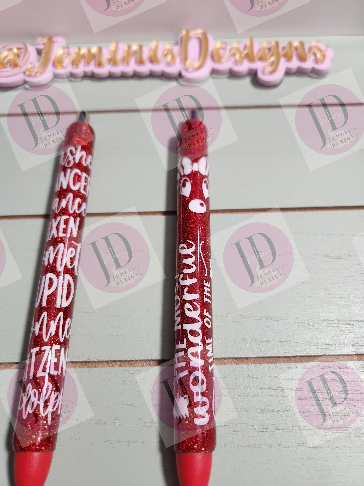 Set of 2 red glitter with white decals. Reindeer names/ clarice & Its the most wonderful time of the year Glitter Gel pens/ refillable